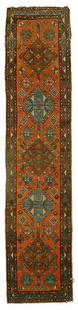 Persian runner,: five central medallions on pale salmon field, blue and brown borders, selvedge wear and losses with some rebinding, end loss, pile varies from none to low, 2'1" x 9'4"