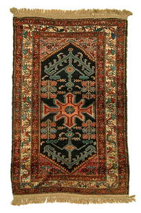 Hamadan rug,: central medallion of repeating geometric and floral designs on dark blue field, pale salmon and ivory borders, generally even low pile, some discoloration, losses and selvedge breaks, scattered pest