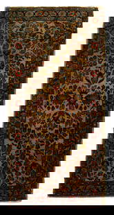 Sarouk rug,: repeating floral designs on an ivory field, red and blue borders, some curling of selvedge, generally even medium pile, some grime, 4'1" x 1'11"