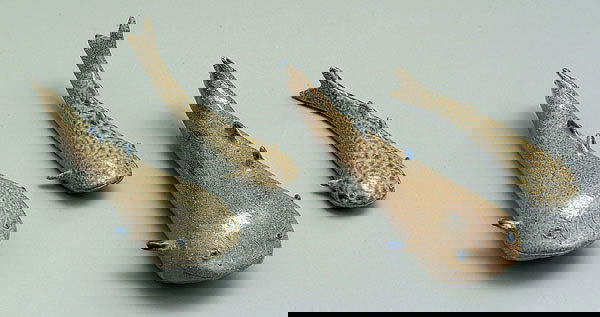 Four Charles Moore catfish: salt glazed stoneware with cobalt highlights, all with impressed marks for Jugtown Ware, 1992, all signed "Charles Moore", 8-1/2" to 11", one with broken fin, 10" catfish with fin off but present