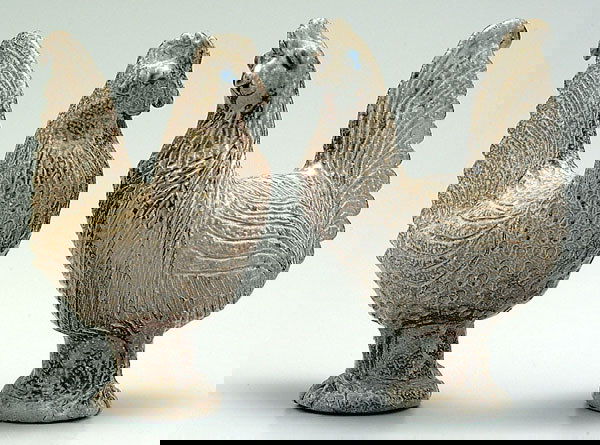 Two Charles Moore roosters: salt glazed stoneware, both with impressed mark for Jugtown, 1992, and script mark for Charles Moore, each about 7-3/4 x 7 x 3"