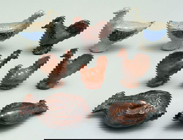 Eight Moravian and/or Jugtown pieces: pair salt-glazed stoneware ducks, marked "Charles Moore, Jugtown, 1993", 4-1/2 x 5 x 2"; three brown-glazed chickens, 3" to 3-1/2"; two Moravian reproduction flasks, 5-3/4" lobster (extensive cracks,