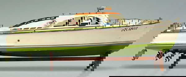 Wooden kit-built boat model,: battery operated, three electric motors wired for lights, rudder stamped "ITO Made in Japan", one rudder loose but present, removable hatches, one cabin door missing, 2" crack in starboard bow, losses