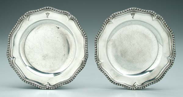 Two George II English silver plates: round with gadroon borders, Edward Wakelin, London, 1759, .925 fine, 32.96 oz.T., 9-1/2 in. Later family crest and "C" monogram, several scratches.