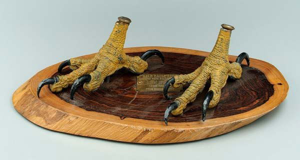 Pair cast lead eagle feet: painted surface, mounted on wooden plaque marked "Bald eagle feet, casting from Baltimore Zoo, Lem Ward, never finished. From daughter Ida", 3-1/2 x 7 in. Some paint losses. Provenance: Collection of