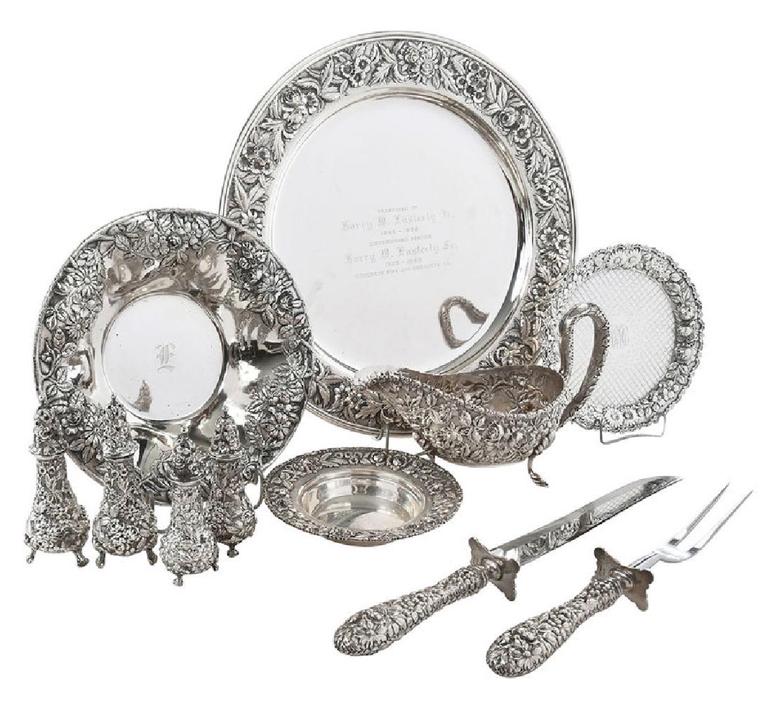 Sixteen Pieces Repoussé Sterling Hollowware: American, 20th century, including large round tray, S. Kirk & Son, inscribed; lobed bowl, S. Kirk & Son; Schultz small round tray; four salt/pepper shakers; Schofield Baltimore Rose gravy bo