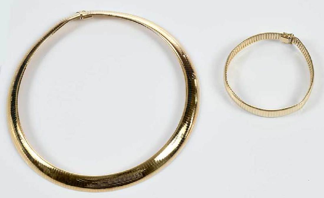 14kt. Omega Necklace & Bracelet: necklace, stamped "14K, Italy" and with hallmarks, yellow gold, 1/2 in. wide, 16 in. lg., 76.5 grams [light wear and scratches]; bracelet, stamped "14k", yellow gold, 3/8 in. wide, 7-1/2 in., 27.3 gra