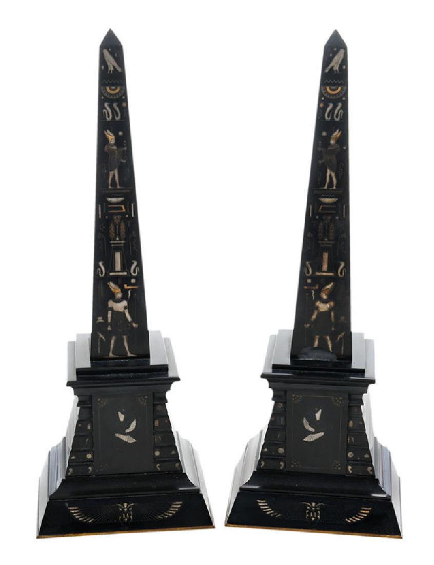 Pair Marble Egyptian Revival Obelisks: Continental, late 19th/early 20th, black marble with incised silver and gilded stylized Egyptian motifs, stepped base, 19 in.