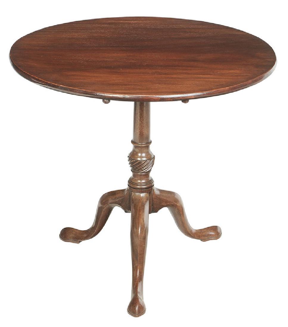George III Carved Mahogany Tea Table: British, 18th century, solid mahogany top tilting over a spiral turn support, tripod base, 27-1/2 x 29-1/4 x 29-3/4 in.