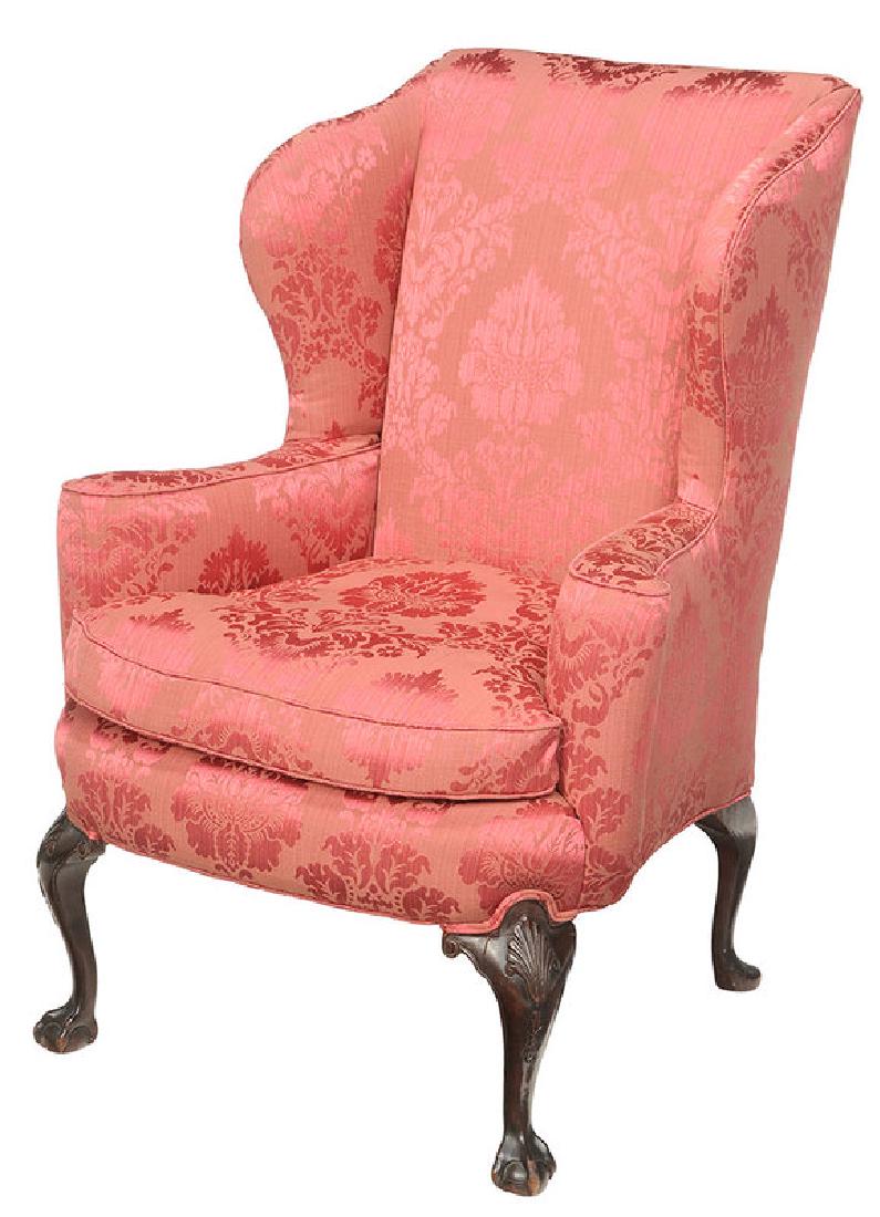 George II Style Damask Upholstered Wing Chair: British, late 19th/early 20th century, carved frame set with fine upholstery, with loose down cushion, 43 in.