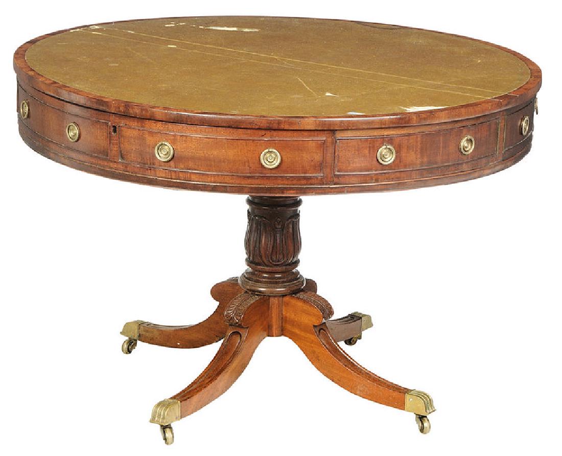 Regency Style Mahogany Leather Top Drum Table: British, late 19th/early 20th century, green leather double hinged top with open interior, four doors with false drawer fronts with brass releases, four additional false drawers, mahogany secondary, w