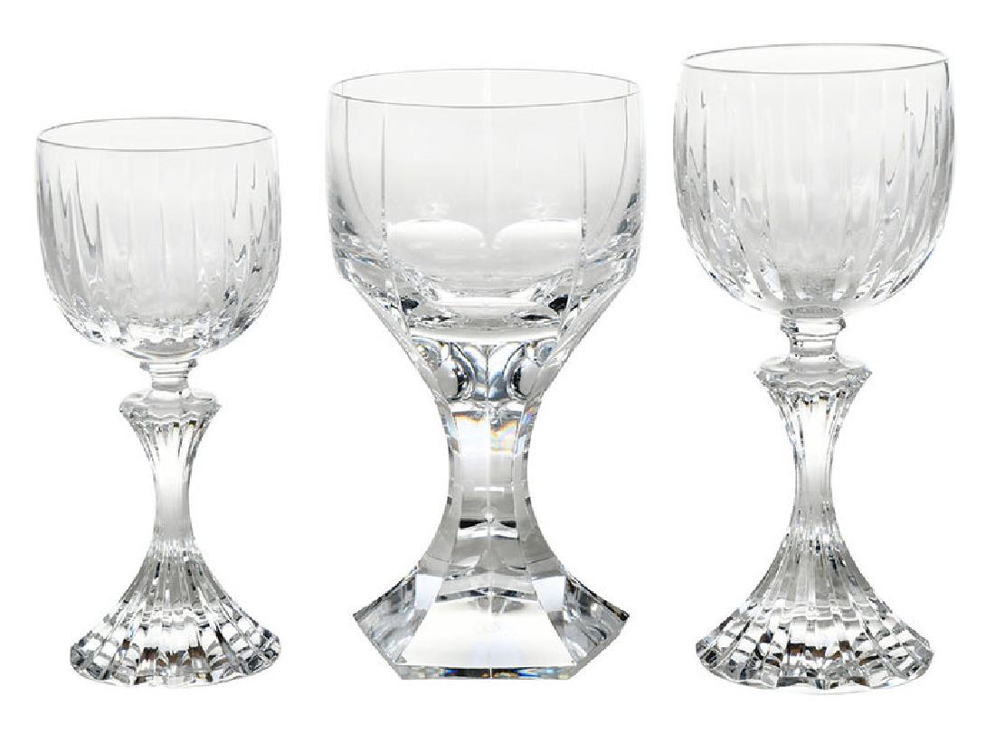 11 Pieces Baccarat and St. Louis Stemware: French, 20th century, four signed Baccarat heavy cut glass goblets, 6-1/2 in.; six signed St. Louis wine glasses, 7 in.; one desert wine glass, 6 in., 10 are housed in blue St. Louis boxes 