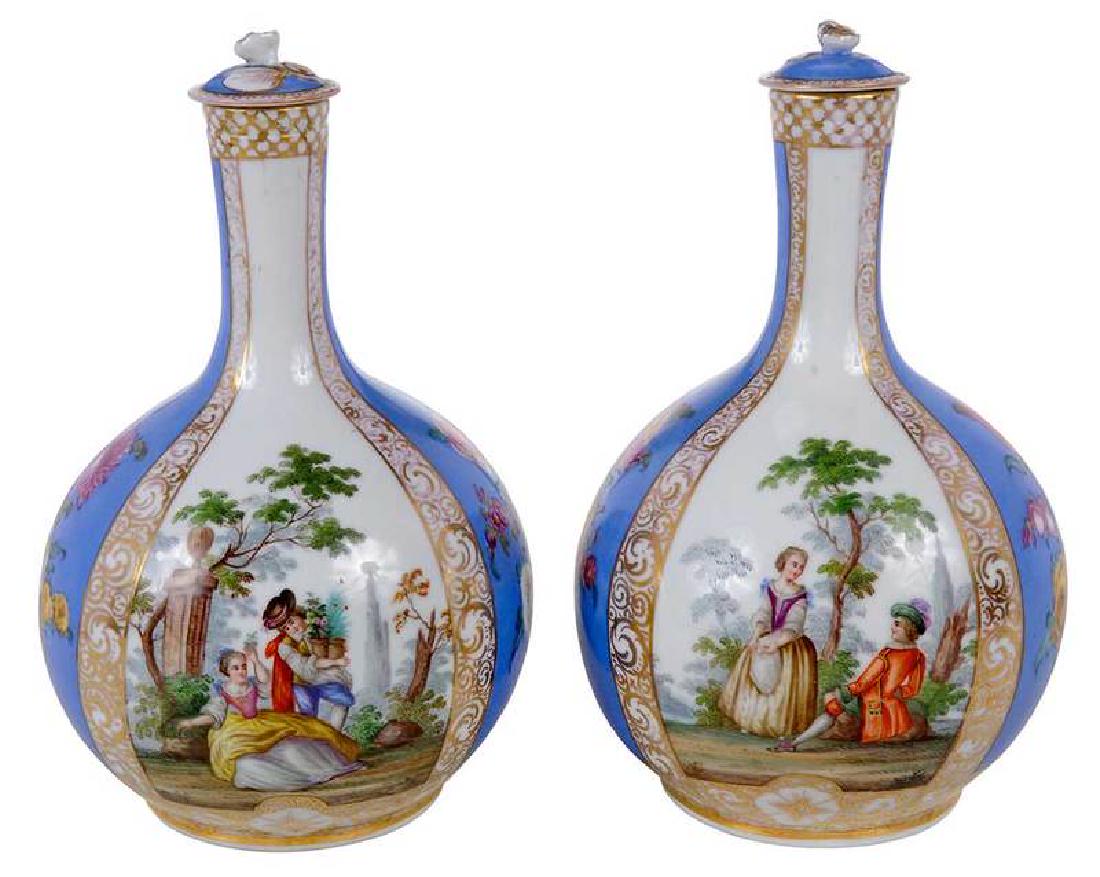 Pair Augustus Rex Style Floral Lidded Vases: Continental, probably late 19th century, likely white Meissen porcelain with later decoration, each bottle form with figural and floral decoration, each fitted lid topped with single flower in high re