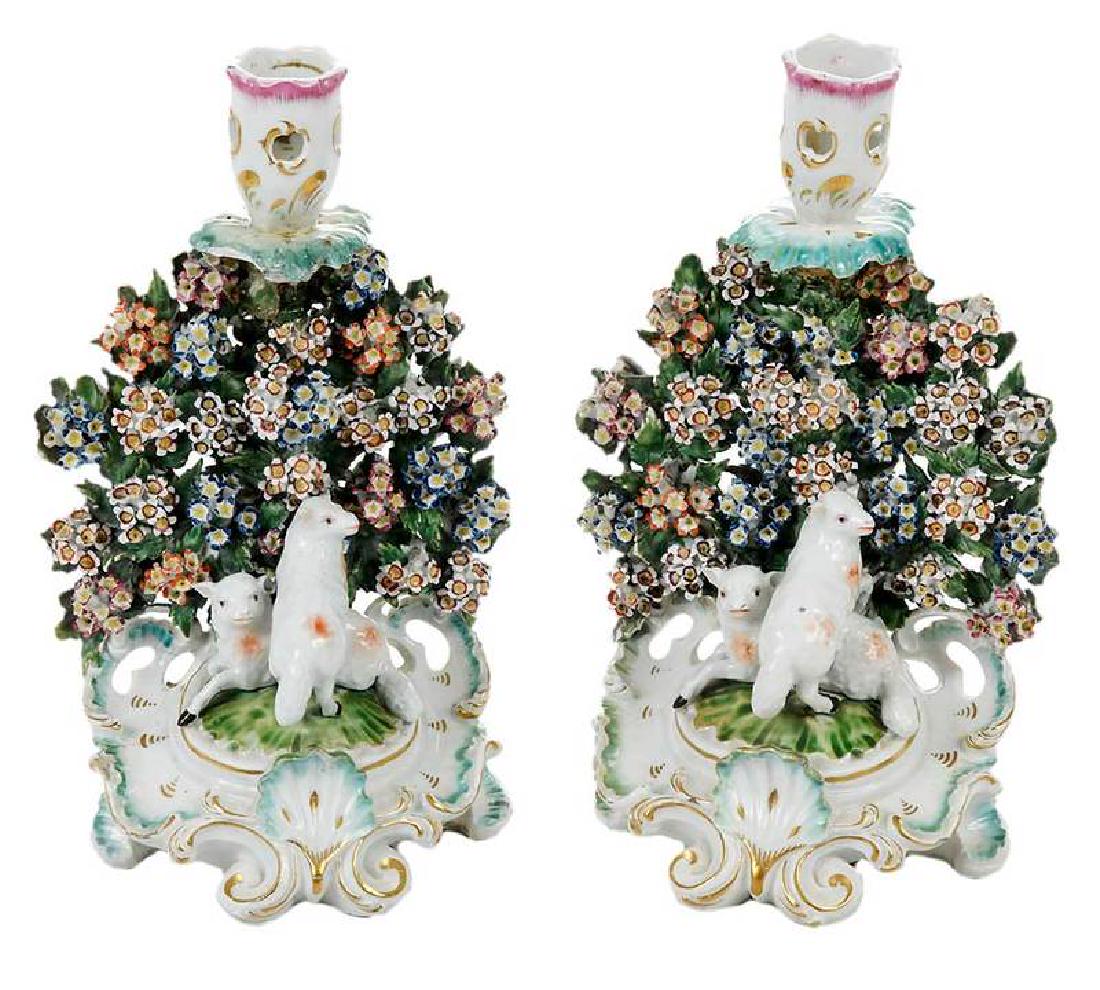 Pair Chelsea-Derby Style Porcelain Candlesticks: British, late 18th century, each with surmounted floral and figural lamb decoration, parcel-gilt, pierced, rococo capital and base, no apparent marks, 9-1/2 in.