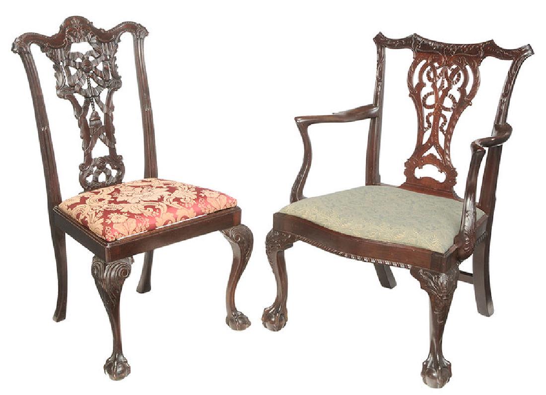 Two Chippendale Style Carved Mahogany Chairs: British, late 19th/20th century, each with ribbon carved back, ball and claw feet, 40-1/2 in.
