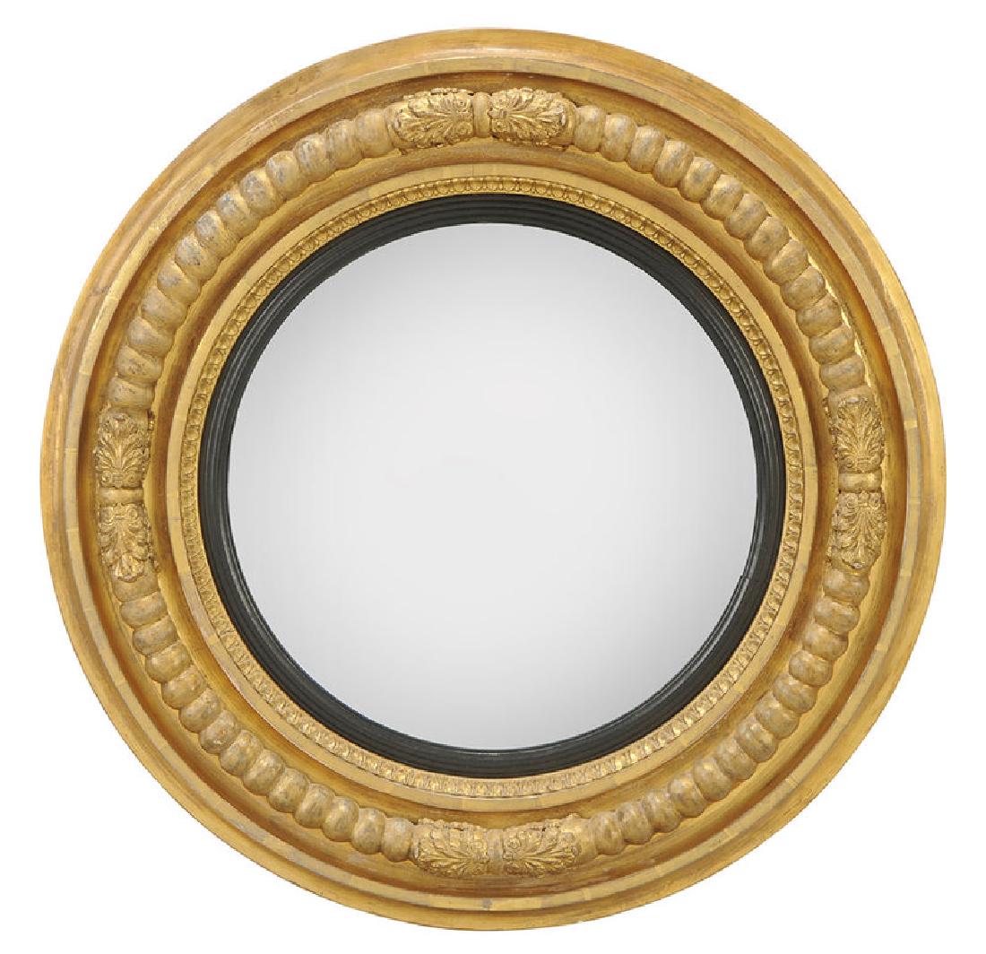Irish Regency Gilt and Ebonized Convex Mirror: 19th century, frame with leaf decoration, mirror plate with ebonized surround, back with period label for "Jackson no 5/Essex Bridge/Dublin", back with partial inscription "1818 (?)", 34-1/2 in.