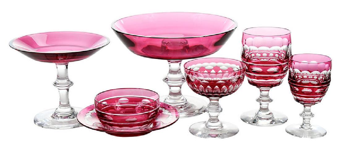 29 Pieces Val St. Lambert Cut to Clear Glass: French, 20th century, three cranberry and clear glass compotes, all signed, two at 5-1/8 in., one at 5-7/8 in.; four desert wines, 4-1/2 in.; six goblets, 5-3/4 in.; six sherbets, 4-1/4 in.; [one with
