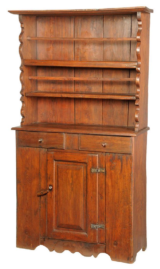 Rare North Carolina Chippendale Walnut Cupboard: Piedmont, mid 18th century, upper case with two plate racks, scalloped trim, lower case with two dovetailed drawers over a latching panel door, probably original carved wood pulls, 75-1/4 x 43-1/2 x 1