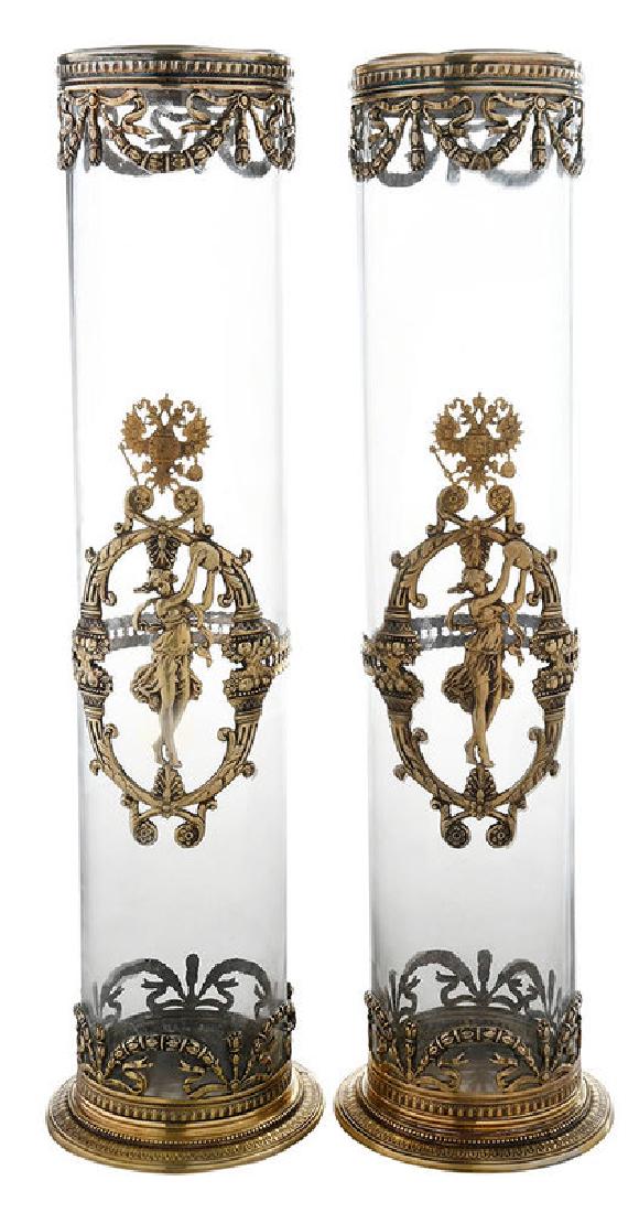 Pair of Russian Silver Mikhail Grachov Vases: late 19th/early 20th century, clear glass cylinder with Russian gilt silver mounts, central lady with instrument with double eagle at top (possibly later), marks for Mikhail Grachev (St. Pet