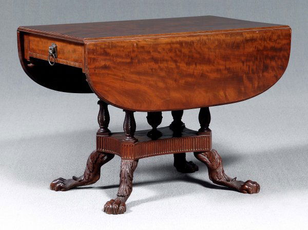Duncan Phyfe breakfast table,: finely figured mahogany with mahogany, pine and birch(?) secondary, base with four finely carved turned posts, on four hairy paw feet with well carved claws, acanthus carved knees, original iron plate