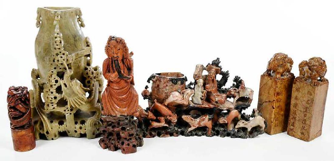 Six Chinese Carved Soapstone Objects: 19th/20th century, comprising: pair seals with figural bixies; single seal "RUTH" and Chinese translation, with dragon and pearl decoration; immortal figure depicted holding a scroll; group with goats