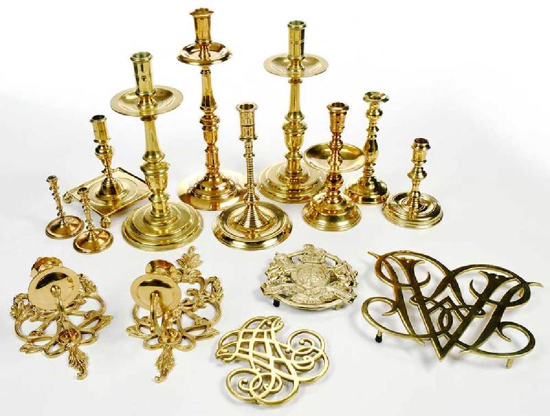 13 Brass 18th Century Style Table Items: 20th century, most Colonial Williamsburg reproductions, including: large pair candlesticks: pair taper sticks; six single candlesticks; three trivets; pair sconces, 4-1/2 in. to 13-1/2 in. Prove