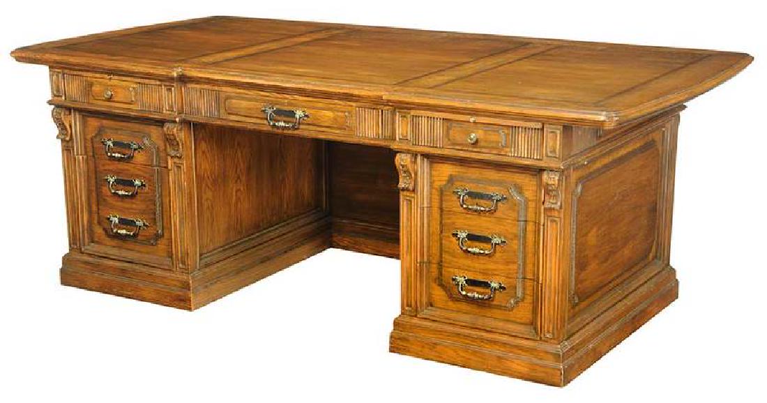 Brass Mounted Oak Pedestal Desk: late 20th century, brass tag for "Romweber Viking Oak", two writing slides, eight drawers, banded top with butterfly inset corners, 31 x 87 x 45 in. Provenance: Property From an Important Tennessee Li