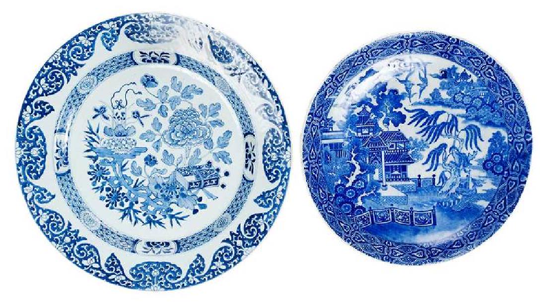 Two Chinese Blue and White Chargers: Qing dynasty, one decorated with peonies and auspicious objects, one with willow decoration, 17 in. Provenance: Collection of Marion and Theodore Gore, Williamsburg, Virginia