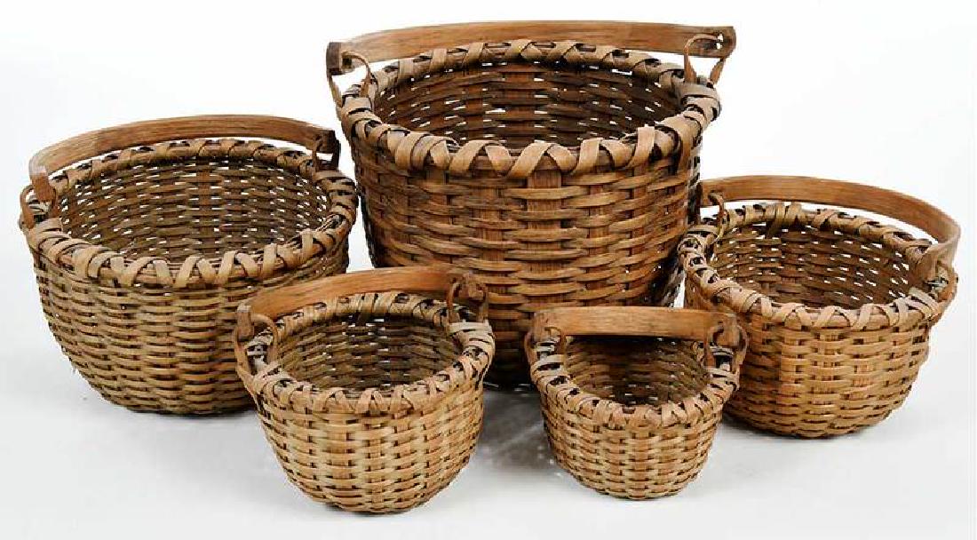 Set Five Split Oak Nesting Baskets: American, possibly Nantucket, 20th century, with swing handles, 2-1/2 in. to 6 in. Provenance: Collection of Marion and Theodore Gore, Williamsburg, Virginia