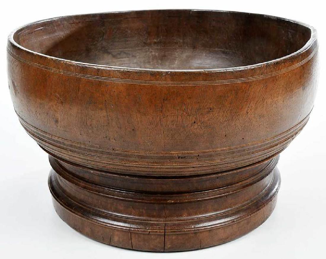 Large Early Hand Turned Treen Bowl: British, probably 18th century, batter bowl with Peaseware-like scored detail, four relief feet, 9-1/8 x 15-1/2 in. Provenance: Collection of Marion and Theodore Gore, Williamsburg, Virginia