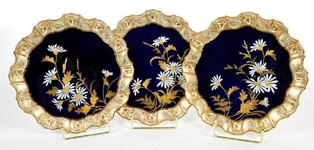 Three Aesthetic Movement Gilt and Cobalt Plates: British, late 19th century, each with marks for Aynsley, finely gilt with daisy decoration, 9 in. Provenance: Private Collection, Asheboro, North Carolina