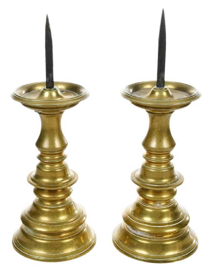 Pair Geddy Foundry Style Brass Pricket Sticks: American, circa 1940s, each colonial style with illegible Williamsburg mark at base, stamped "Max Rieg" (German/American, 1899-1985), 11 in.Provenance: Private Virginia Collection