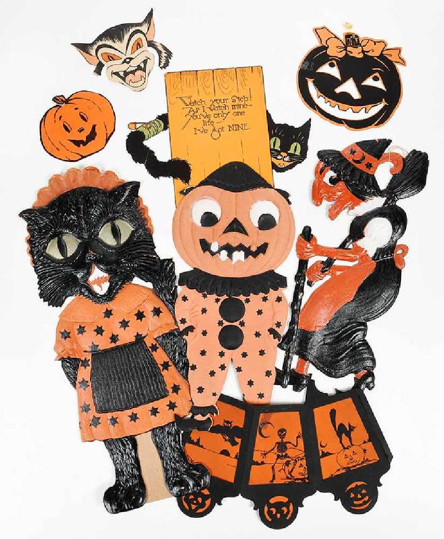 70 Pieces Halloween and Related Paper Ephemera: German/American, 19th/20th century, articulated and wall decorations, approximately 45 Halloween pieces including six German Halloween die-cuts, jack-o-lantern bucket, accordion-style lanterns, black 