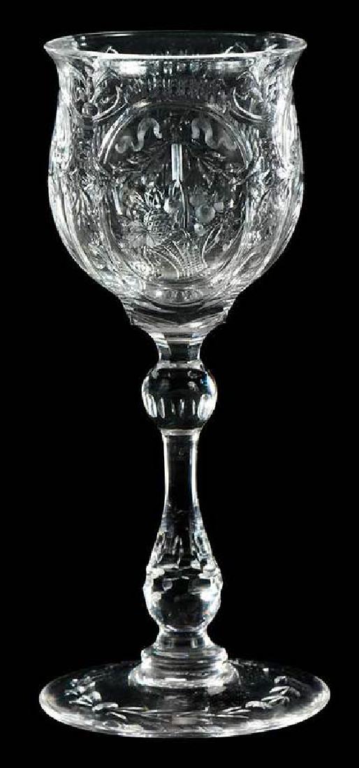 Wm Fritsche and Thomas Webb Cordial: '"rock crystal" stem, bowl engraved in ornate panels of floral baskets with ribbons and swags, one panel signed "Wm Fritsche", and base with engraved "Webb" mark, 6 in.