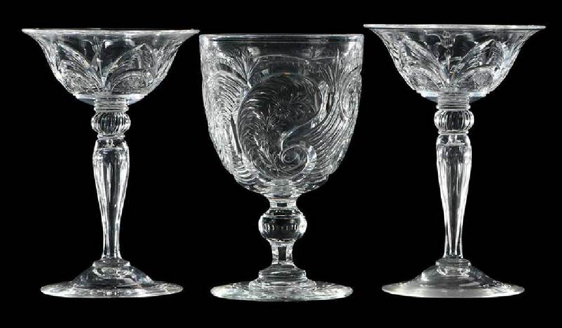Three Steuben "Rock Crystal" Stems: pair of "Poussin" pattern wines, signed "Steuben", 6-1/4 in.; "Lambeau" pattern, Steuben goblet, shape 6959, 6-1/4 in. 