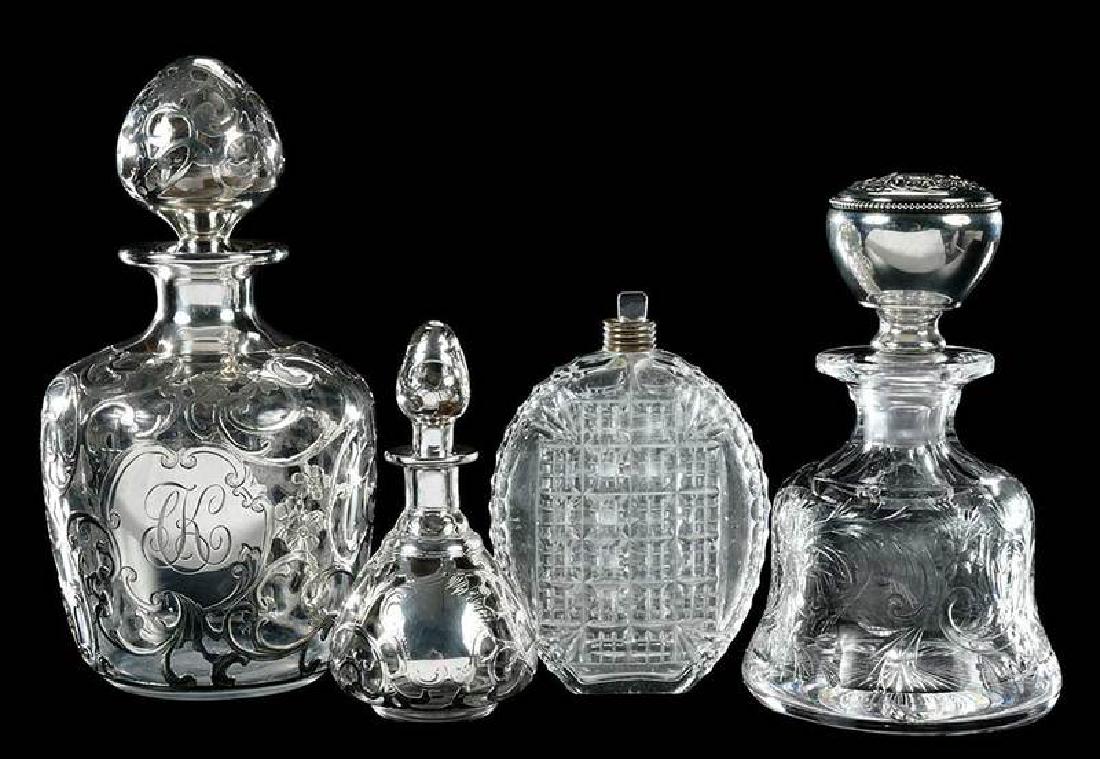Cut Glass Silver Overlay Perfumes, Flask: "Rock Crystal" perfume, silver clad stopper, 6-1/8 in., [minute chip under top edge, small dents to silver overlay]; larger silver overlay dresser bottle, 7-1/2 in., [whitish residue to bottom of inte