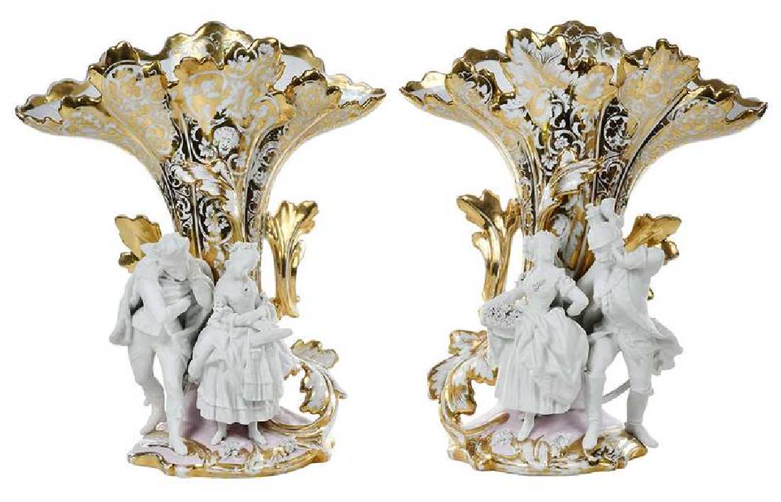 Pair Old Paris Vases with Bisque Figures: French, 19th century, gilt decorated with pink accents vases, each with pair of bisque Parian courting figures at base, 17 in.