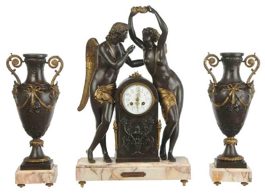 Empire Style Marble and Parcel-Gilt Garniture: French, circa 1900, three spelter objects, each set on a [kuros doré] plinth, comprising: one figural clock depicting [Psyché couronnant l'Amour] (after Jean Baptiste Greuze, F