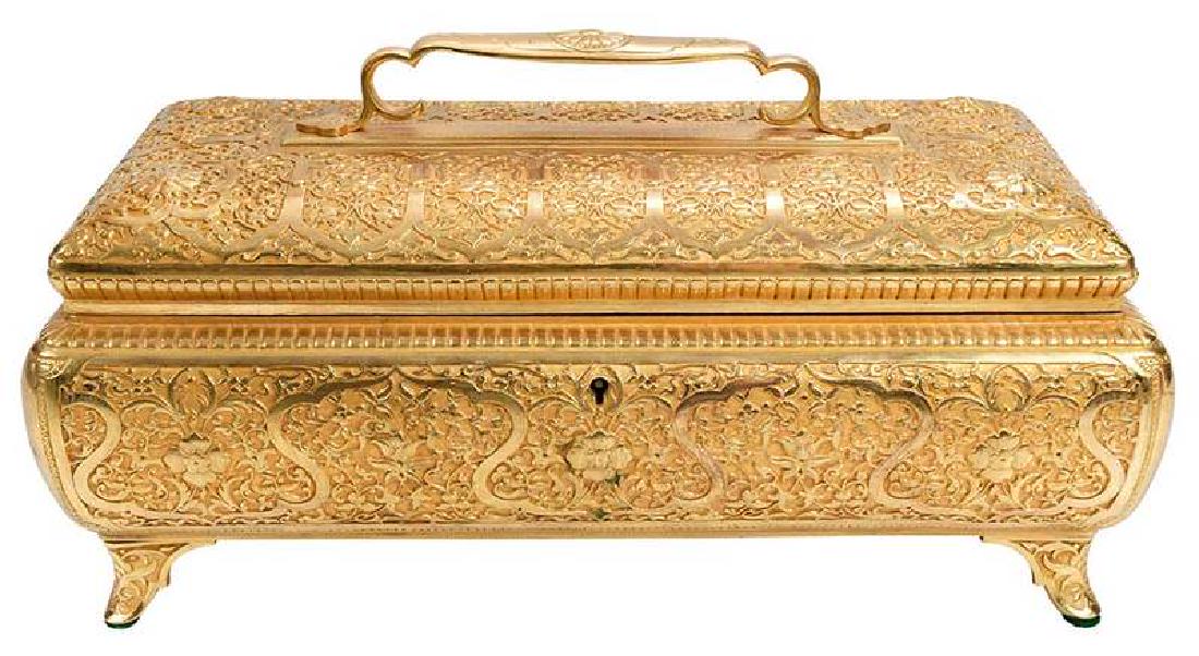 Gilt Bronze Arabesque Designed Box: probably French, late 19th century, rectangular with hinged cover and applied handle, intricately decorated in relief with repeating foliate, flowers and scrolling vines, tufted silk interior, stamped