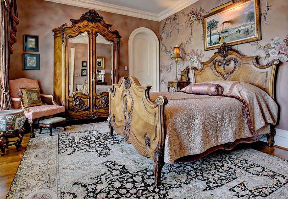 Provincial Louis XV Carved Walnut Bedroom Set: French, late 19th/early 20th century, three very finely constructed pieces with scrolled and foliate decoration, comprising: one armoire, double beveled-mirror doors open to a bird's-ey