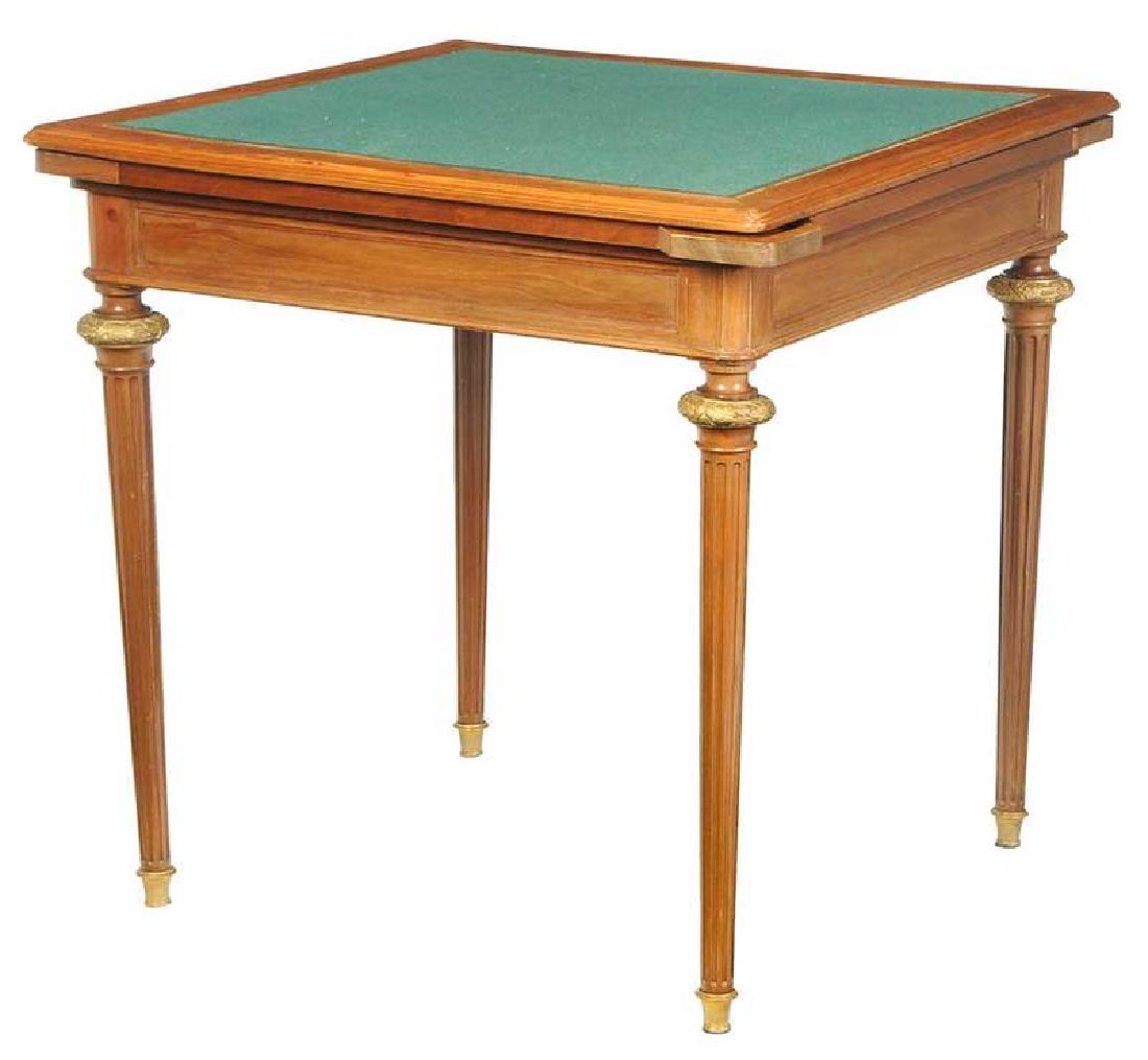 Louis XVI Style Bronze-Mounted Games Table: French, early 20th century, stamped "Krieger/Paris", felt lined-top, single dovetailed drawer, four ratcheted, pull-out, covered chip cups, fluted legs with bronze capitals and feet, 31 x 31 x 31