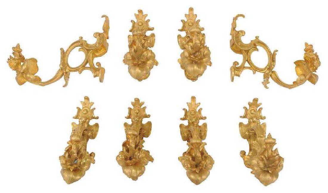 Set of Eight Gilt Bronze Curtain Tie Backs: Continental, 20th century, scrolled design with foliate and floral decoration, 7 x 8-1/2 in. Provenance: Property From an Important Tennessee Living Estate
