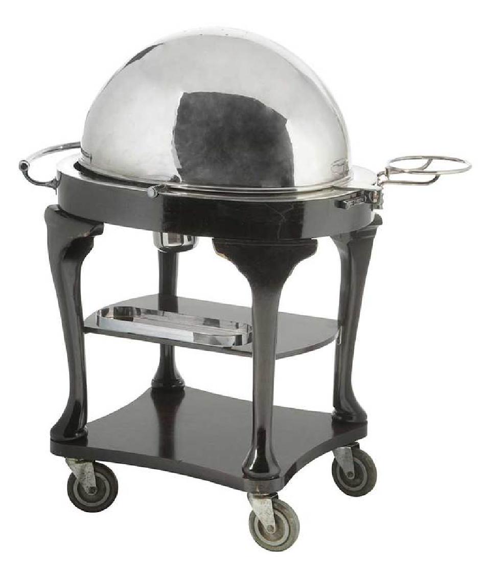 Vintage Silverplate and Mahogany Serving Trolley: British, early 20th century, label for "Drakes/Brewer St., London" at handle, the lockable, domed, roll-back lid encloses a warming plate over two burners, mahogany frame with rosewood-grained laminat