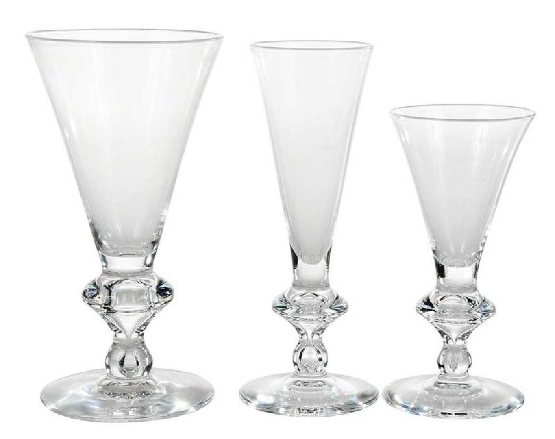 Steuben Glass Stemware Set of Twelve: American, circa 1930, signed, original box with ten green labeled sleeves, Art Deco inspired, pattern 7737 designed by Sidney Waugh, bulb stem with air bubble, comprising: four wine, 5-3/4 in.; four w