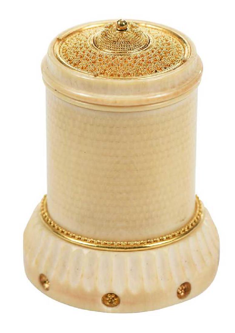 Daniel Brush Gold Turned Snuff Bottle: ornamental turning, diamond cut mastodon ivory, high karat gold granulation on lid and around base, 1-5/8 x 1-1/8 in., 19.5 grams, with custom made wood box Provenance: Private CollectionNote: &#