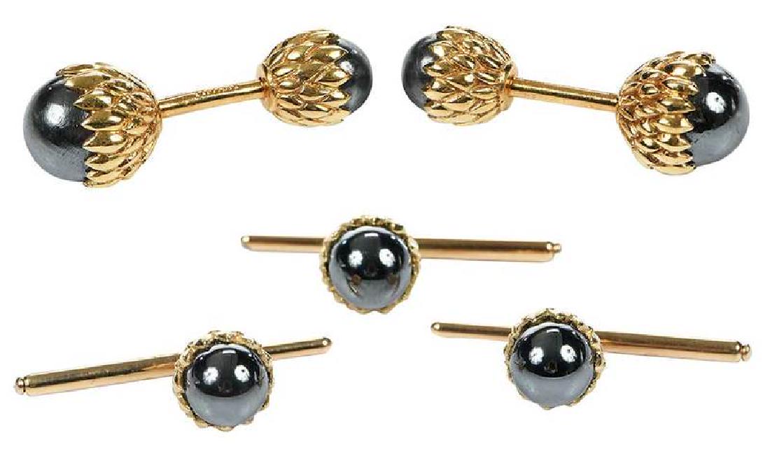 14kt. Acorn Cufflinks and Shirt Studs: cufflinks, hematite, spurious stamps "Tiffany, Schlumberger", tested 14kt. yellow gold, 14.4 grams; shirt studs, hematite, stamped "14kt", yellow gold, 11.9 grams Provenance: Provenance Collection