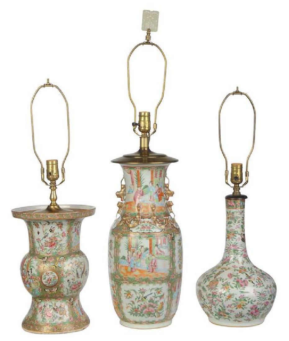 Three Chinese Famille Rose Porcelain Vases: late Qing dynasty, each fitted as a lamp, comprising: one baluster-form decorated with rose medallion, gold dragons, and foo dogs, 17-3/4 in.; one rose medallion gu-form, 12-3/4 in.; one [tianqiuping]