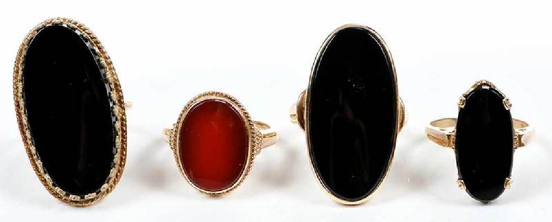 Four Gold & Gemstone Rings: oval flat-topped carnelian, stamped "14K", yellow gold, size 6-1/4, 5.5 grams [light wear]; oval flat-topped black onyx, stamped "14K" and with maker's mark, yellow gold, size 7-1/4, 9.0 grams [tarnis