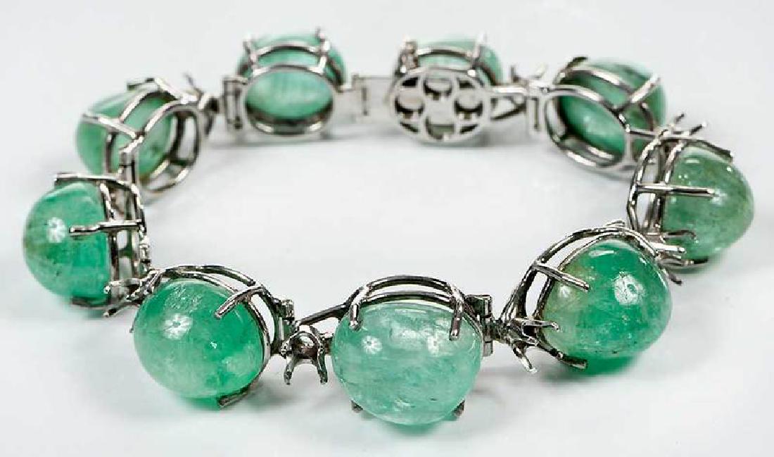 14kt. Gold & Beryl Bracelet: nine green beryl cabochons ranging from approx. 14 x 11 to 17 x 13mm, tested 14kt. white gold, 7 in. lg., 42.8 grams 