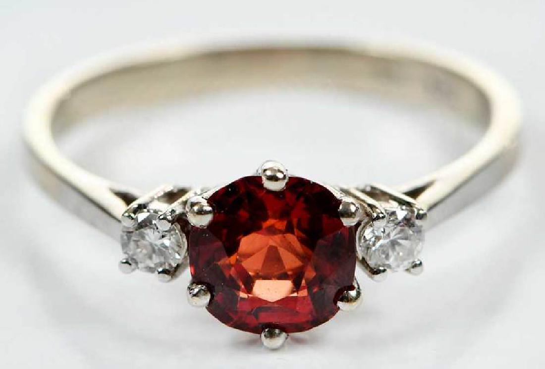18kt. Gold Ring: cushion cut synthetic red spinel approx. 6.3 x 6.3mm, two round brilliant diamonds, stamped "18K, CB", white gold, size 7, 2.5 grams